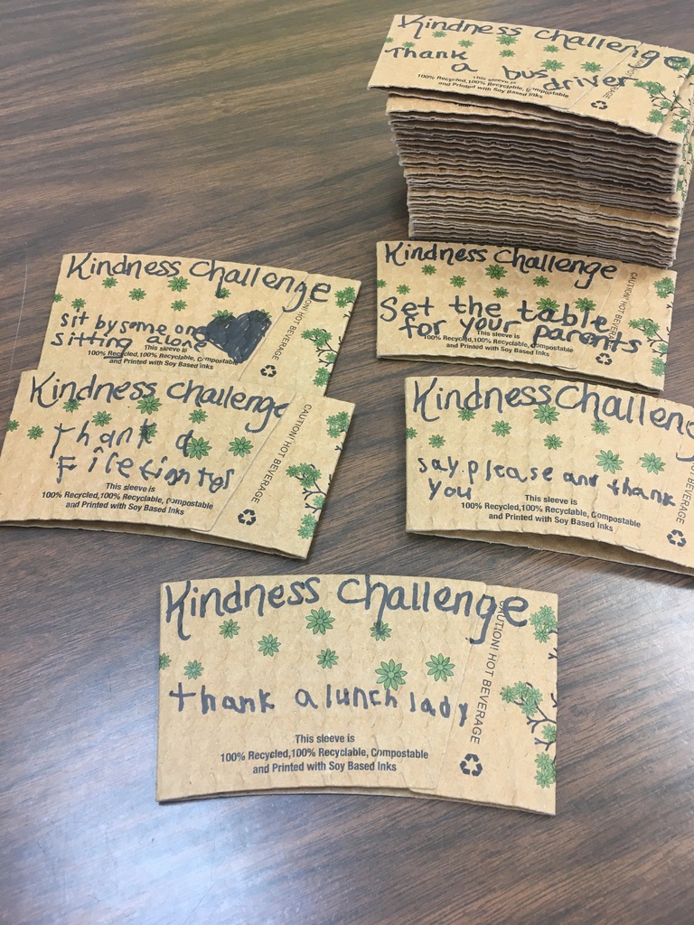 Coffee cup sleeves with sayings on them.